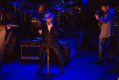 Bob Dylan, on the harmonica, performing in Argentina April 2012 (Photo Adrian Lasso, Creative Commons)