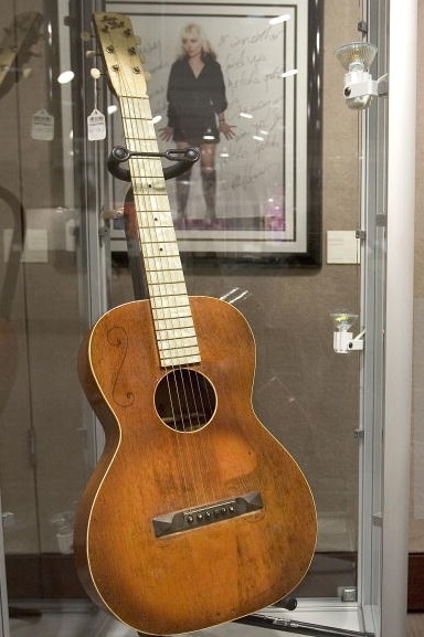 Woody Guthrie’s 1930s Slingerland May Bell guitar worth $70,000 in 2006 at Christie’s NYC (photo Stephen Chernin Getty Images)